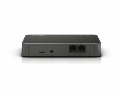 A compact, black Oticon ConnectLine Phone adapter 2.0 with two Ethernet ports, a round audio/reset port, and a micro USB port on the back is shown against a white background.