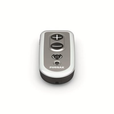 The Phonak PilotOne II is a compact, oval remote with two large plus and minus buttons and a smaller circular button below them, shown against a white background.