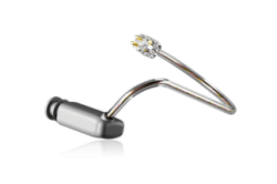 A silver Easywear wired RIC (M-Receiver) earpiece features a curved, thin metal frame and a small clear gem-like decoration near the earpiece, displayed on a light background.