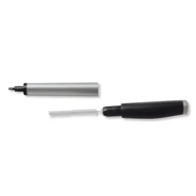 A round multifunctional tool lies open, with its wand and bristle brush—resembling a hearing aid cleaning device—visible beside the detached cap.